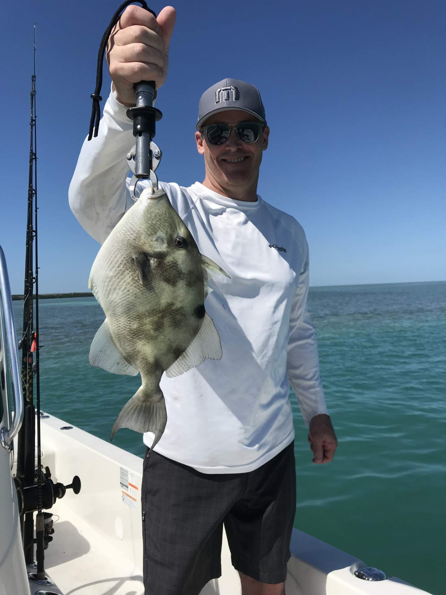 Man holding a trigger fish