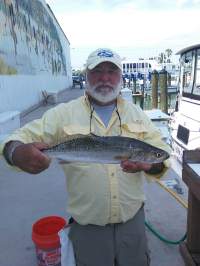 Man holding Trout caught from Backcountry